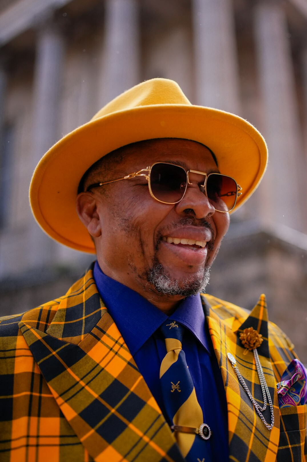 Professional portrait of a man in a suit smiling
