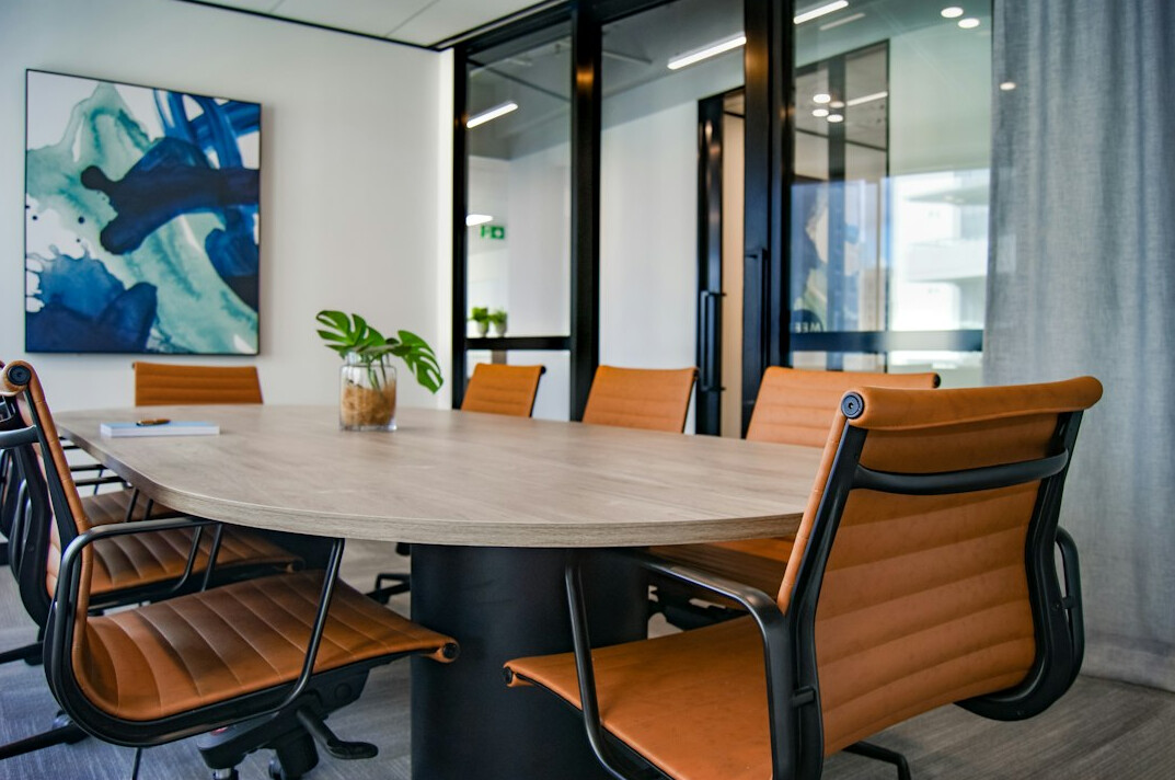 Bright office reception with table and chairs