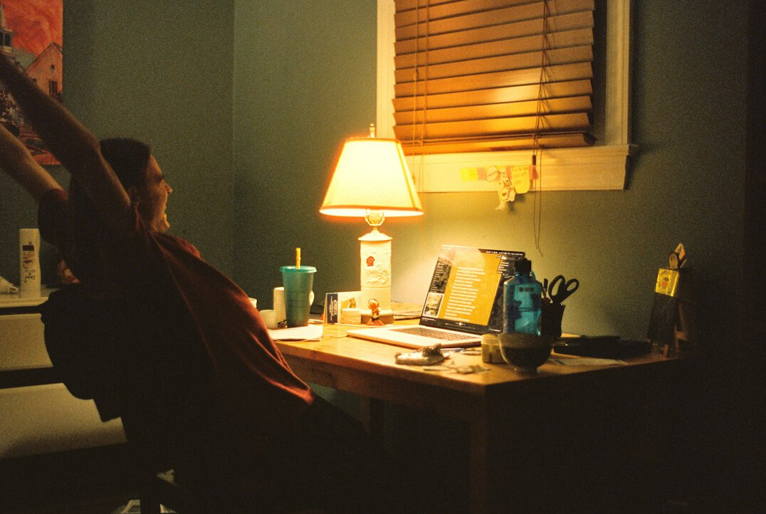 person meditating at desk
