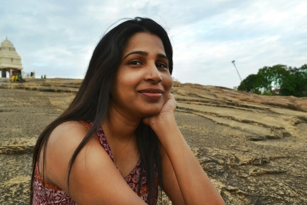 Portrait of a young woman with long hair smiling